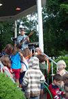 kids return hula hoops to stage